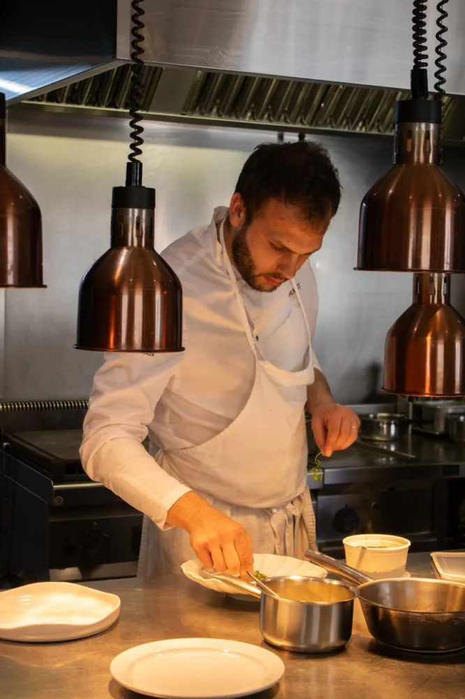 Vilagut Restaurant chef plating in the kitchen