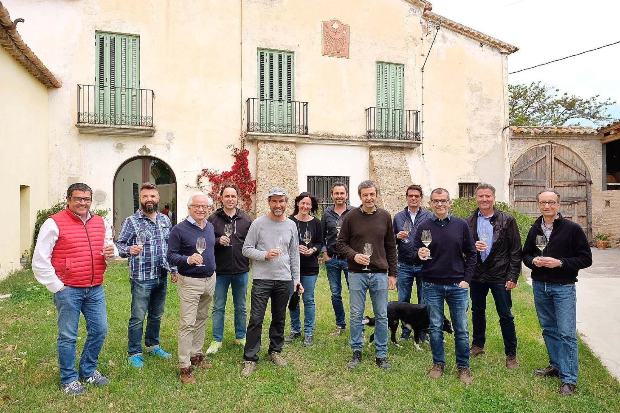 Corpinnat's new board in front of a farmhouse