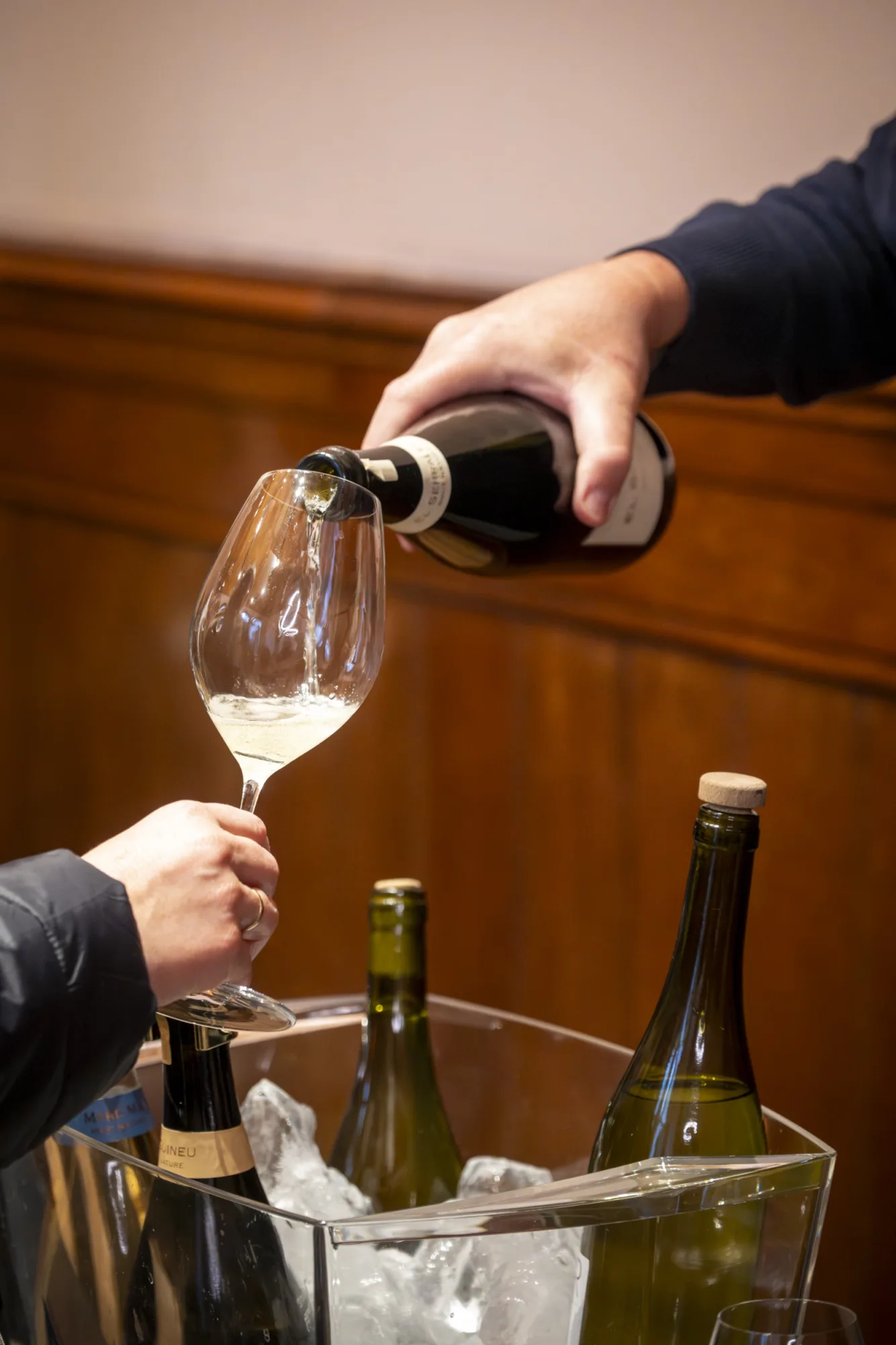 Pouring Corpinnat sparkling wine into a glass