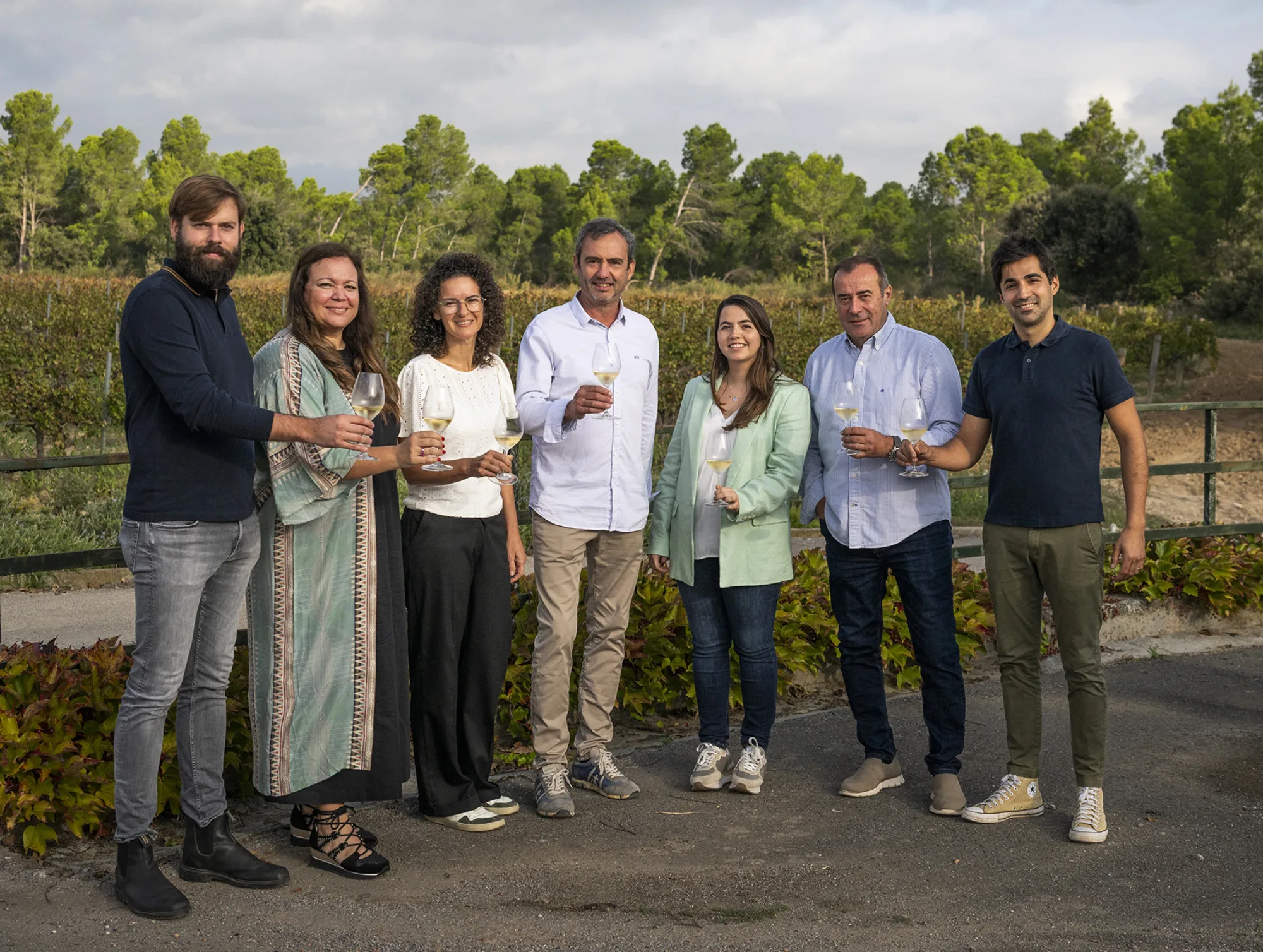 Corpinnat, Mas Bertran and AT Roca teams toasting outdoors