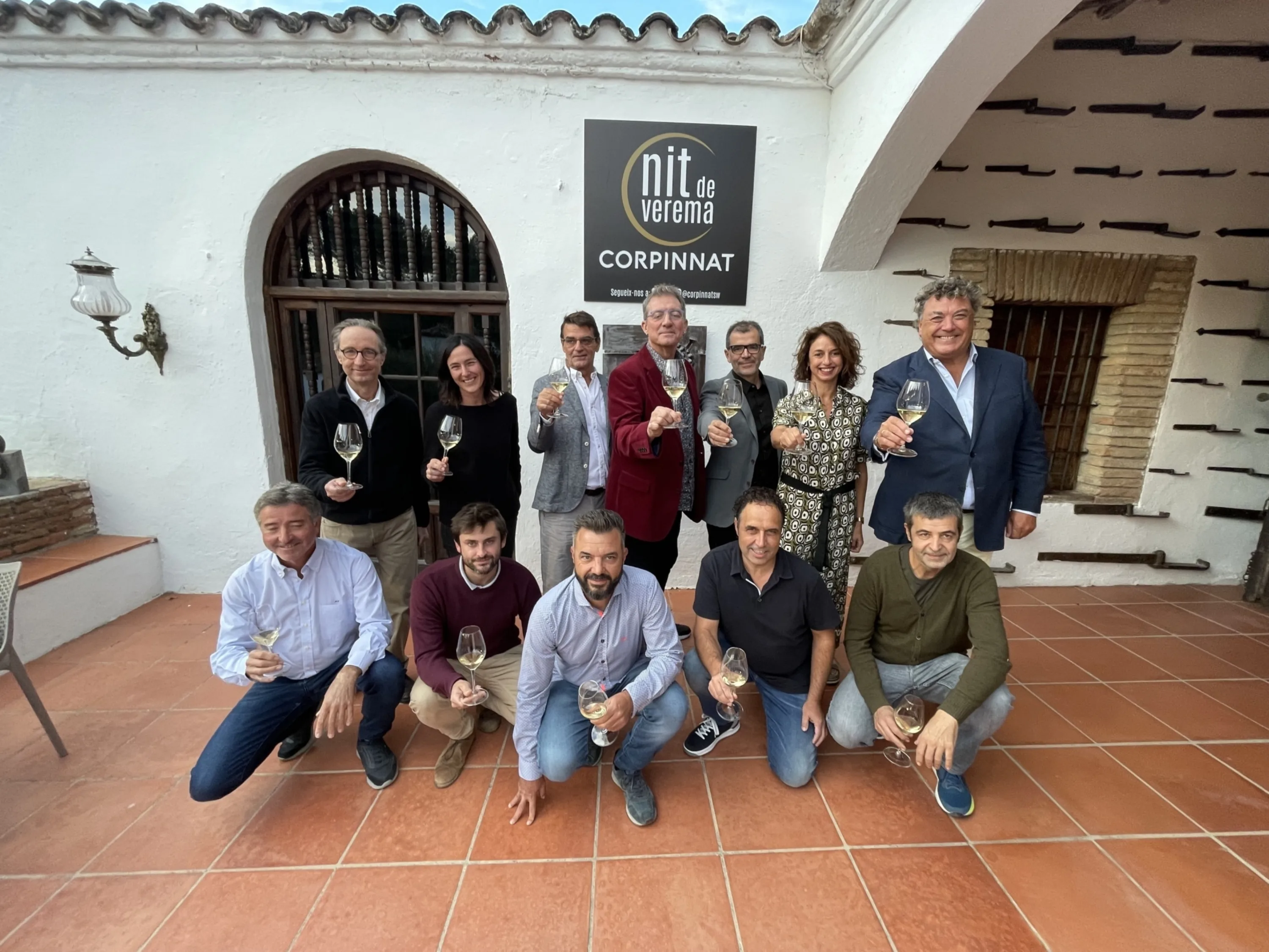 Corpinnat winery representatives at a winery entrance