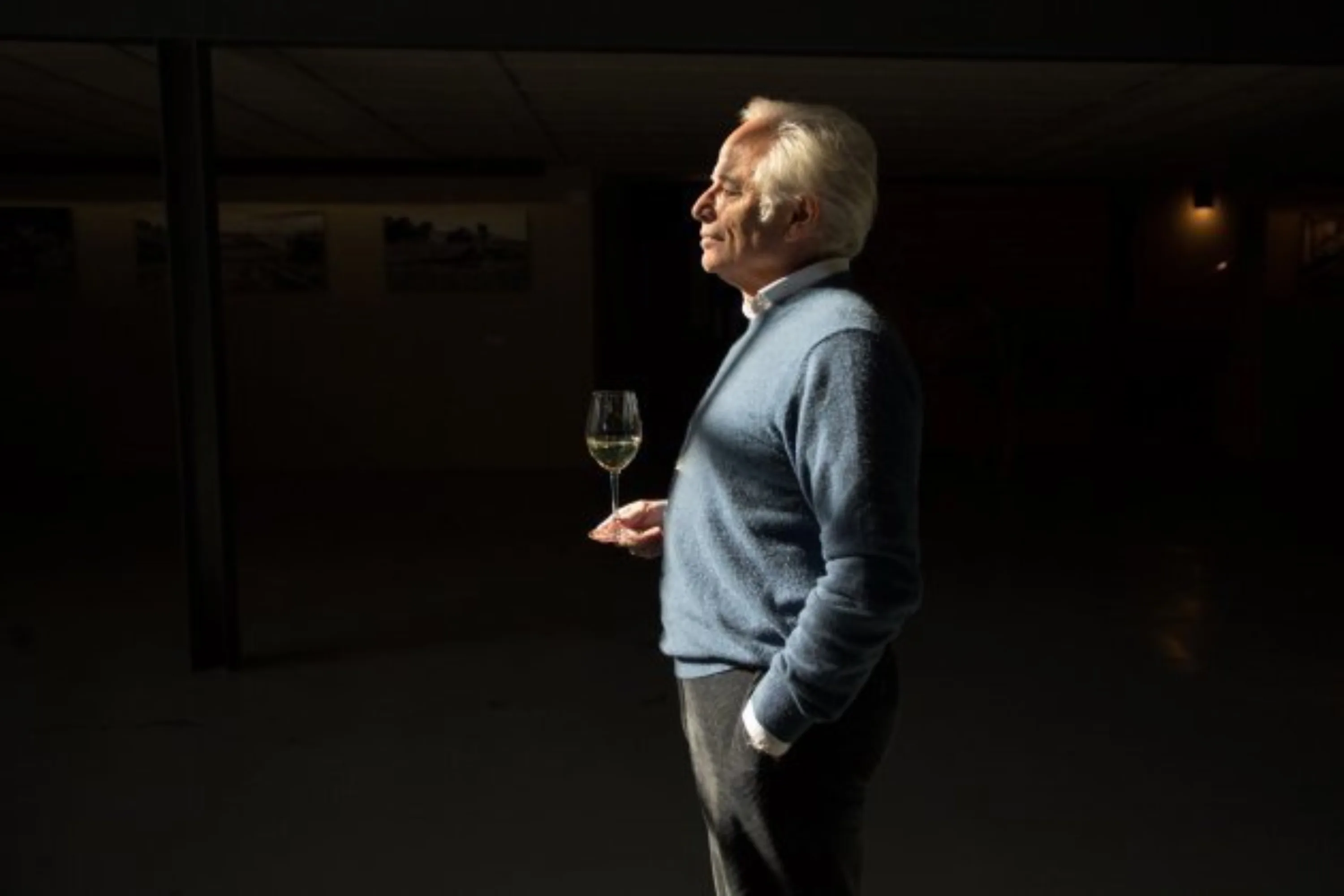 Xavier Gramona with a glass of sparkling wine in a cellar